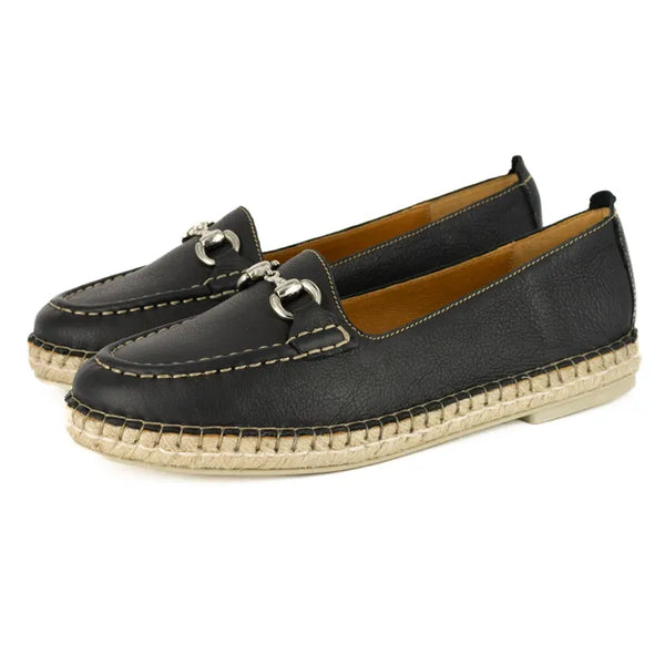 Pair of black leather espadrilles with metallic accents on a white background