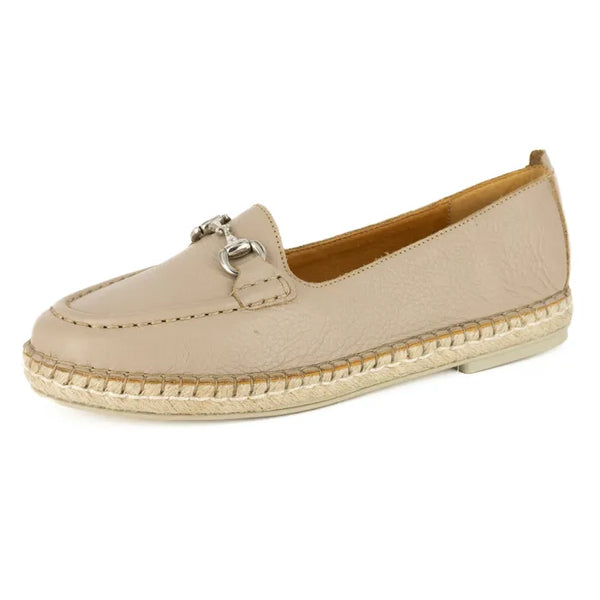 Beige espadrille shoe with a metallic buckle on a white background