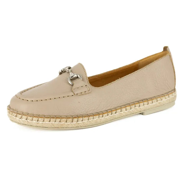 Beige espadrille shoe with a metallic buckle on a white background