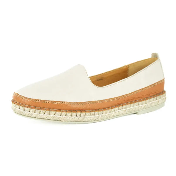 Cream espadrille shoe with brown sole on a white background