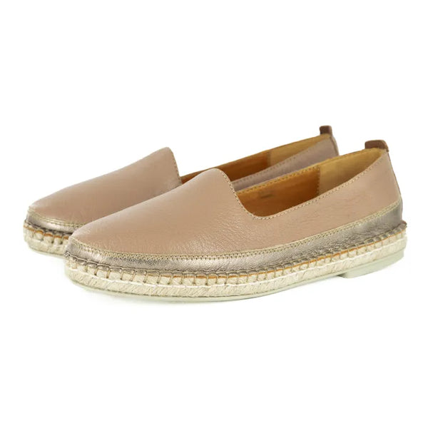Pair of beige espadrille shoes on a white background