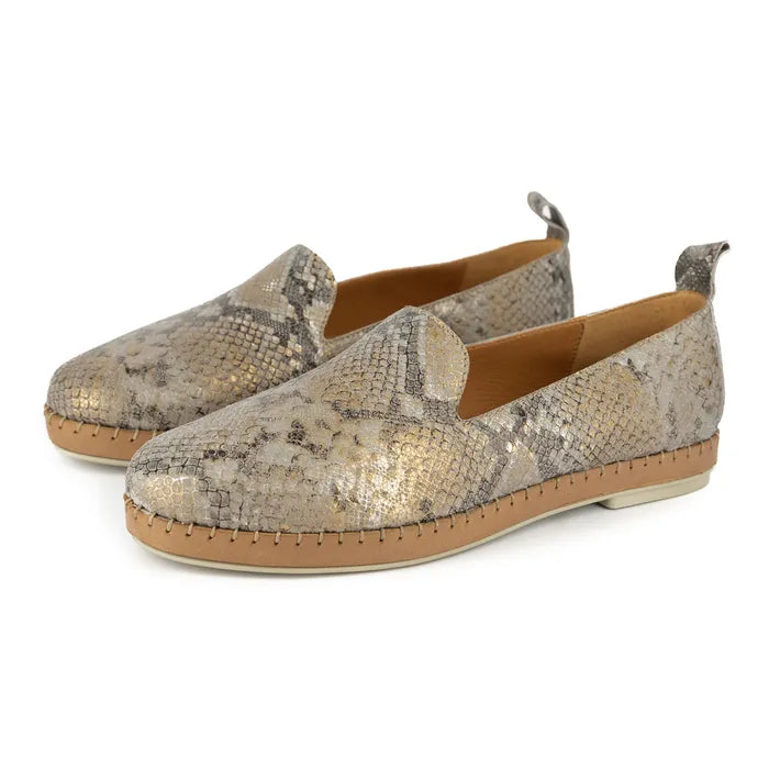 Pair of snake print loafers on a white background