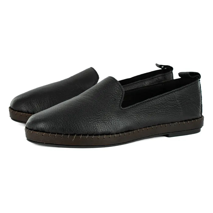 Pair of black leather loafers on a white background
