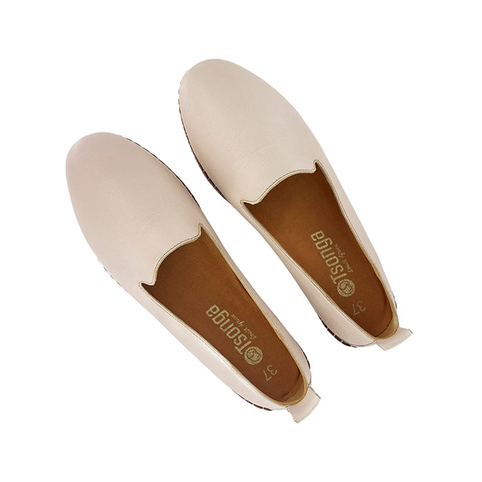 Pair of beige loafers on a white background