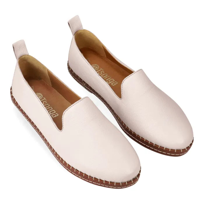Pair of cream espadrilles with brown soles on a white background