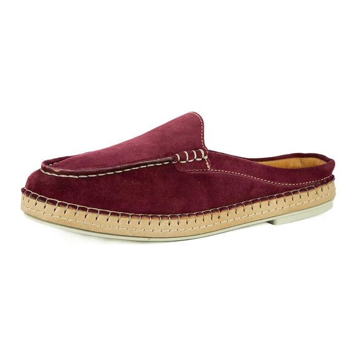 Maroon slip-on shoe with beige sole on a white background