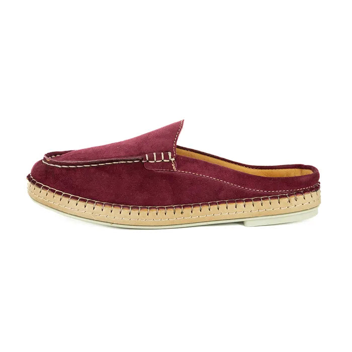 Maroon slip-on shoe with a textured sole on a white background