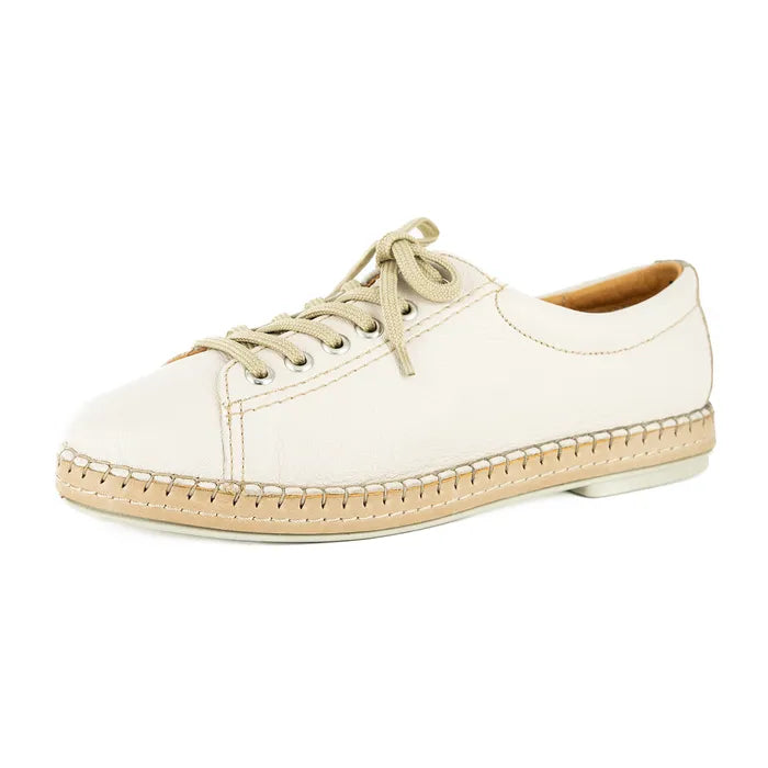 Cream sneaker with beige accents on a white background