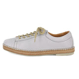 Light grey sneaker with beige sole on a white background
