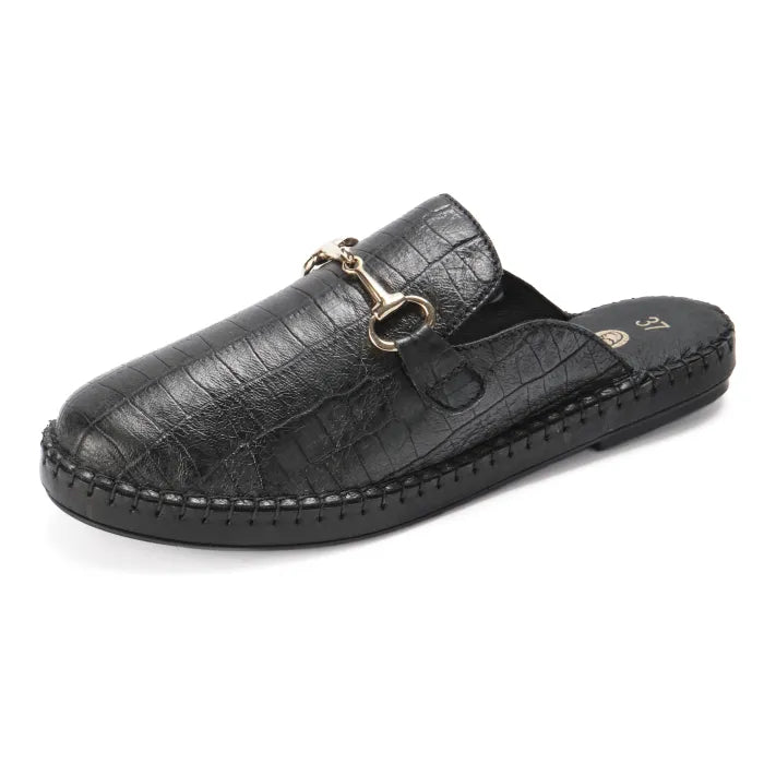 Black patterned slip-on shoe with a gold buckle on a white background