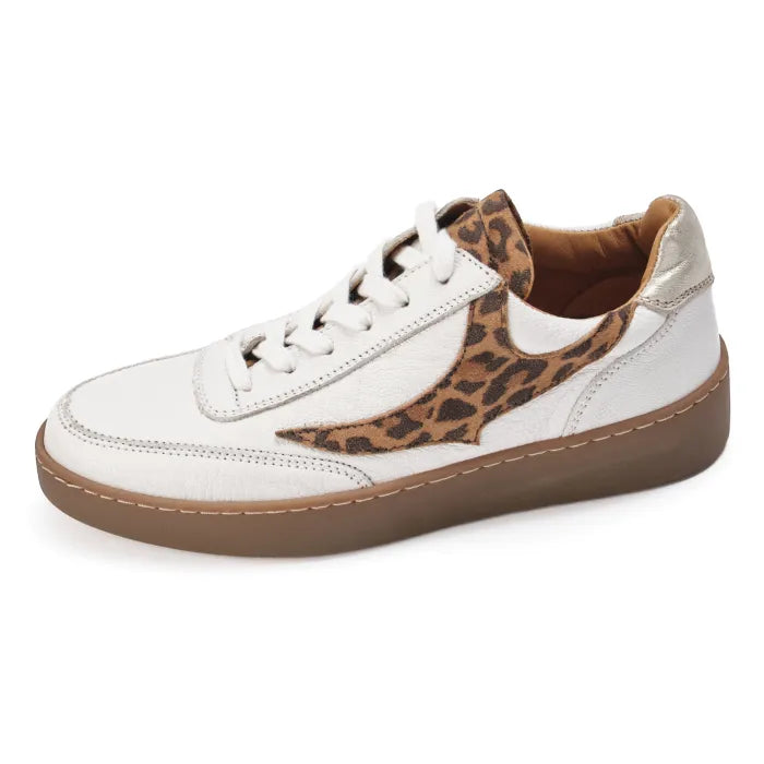 White sneaker with leopard print accents on a white background