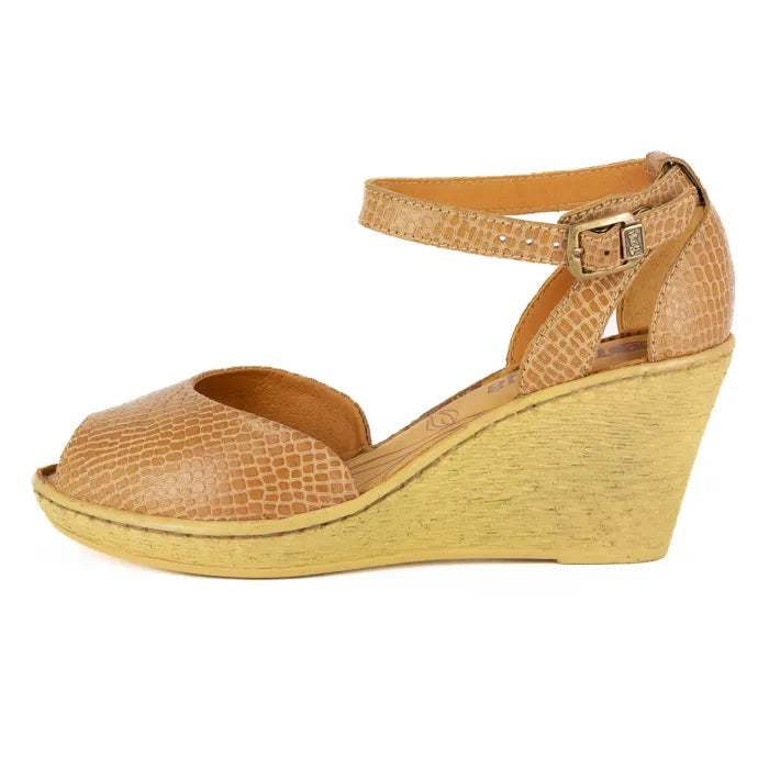 Tan wedge sandal with a wedge sole on a white background