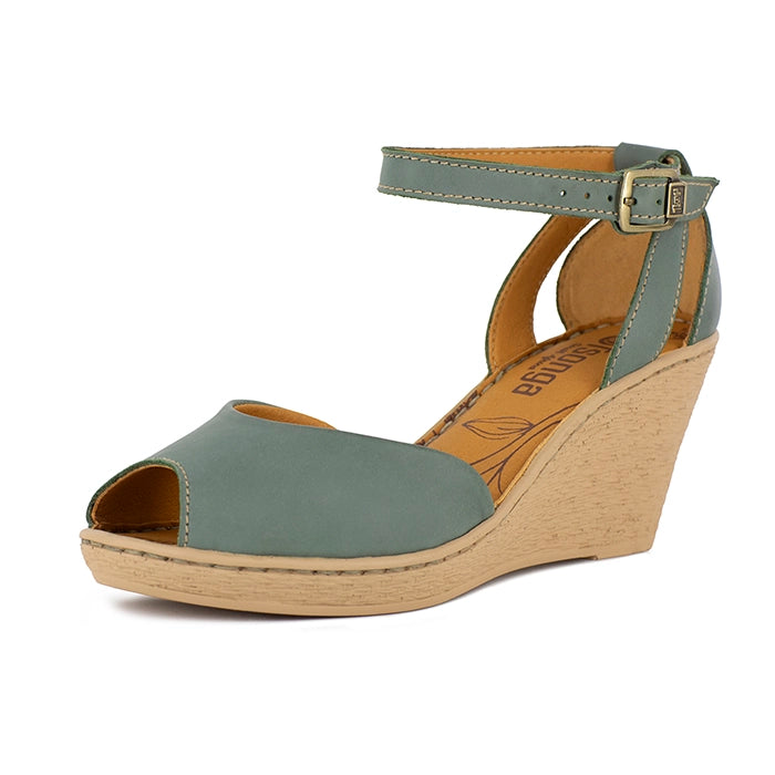 Wedge sandal with green upper and beige wedge sole on a white background