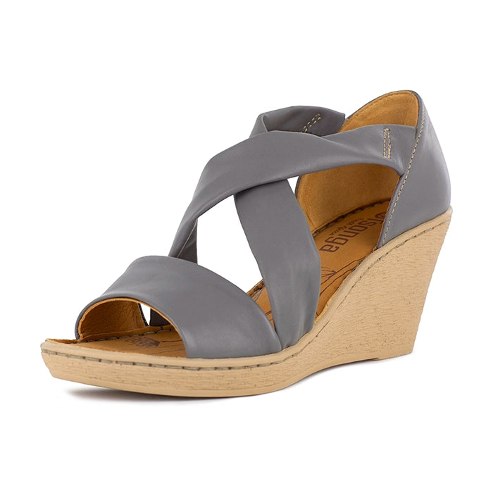 Grey wedge sandal with a beige sole on a white background