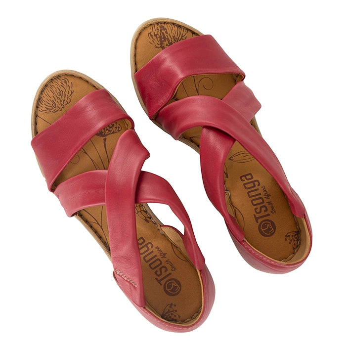 Pink sandals with 'Tsonga' branding on a white background