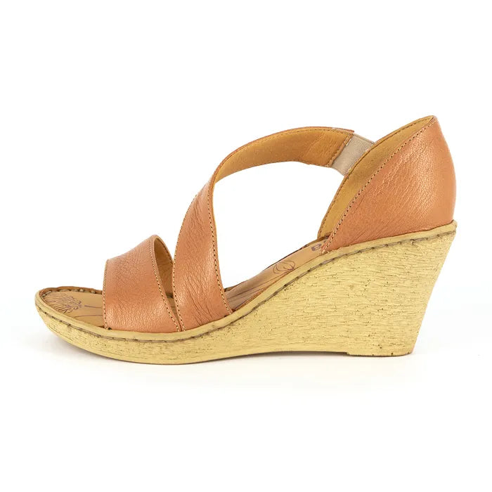 Tan wedge sandal on a white background