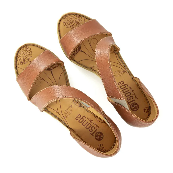 Pair of tan sandals with 'Tsonga' branding on a white background