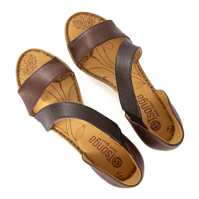 Pair of brown sandals with tan soles on a white background