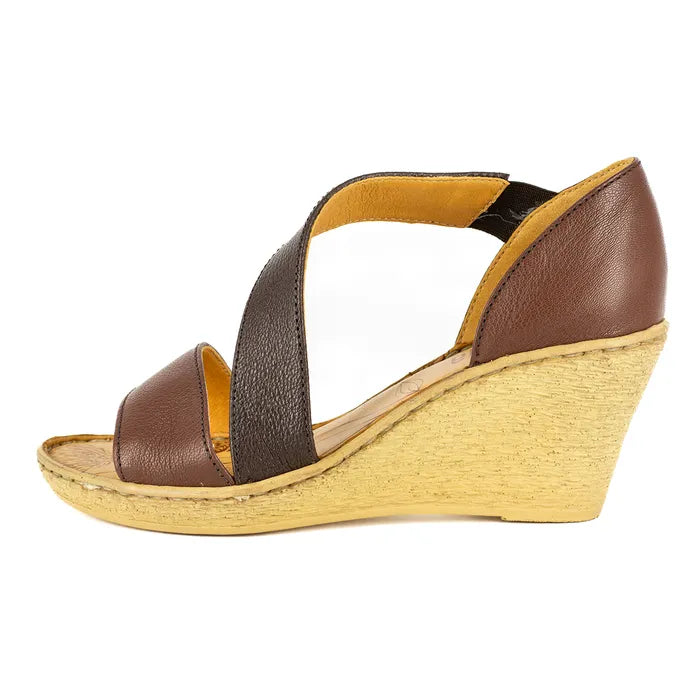 Brown wedge sandal with a wedge sole on a white background