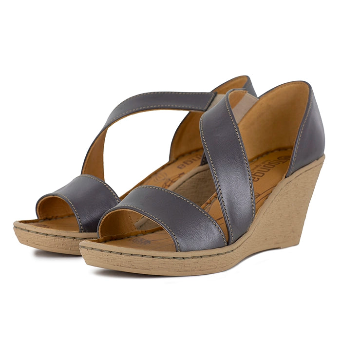 Pair of silver wedge sandals on a white background