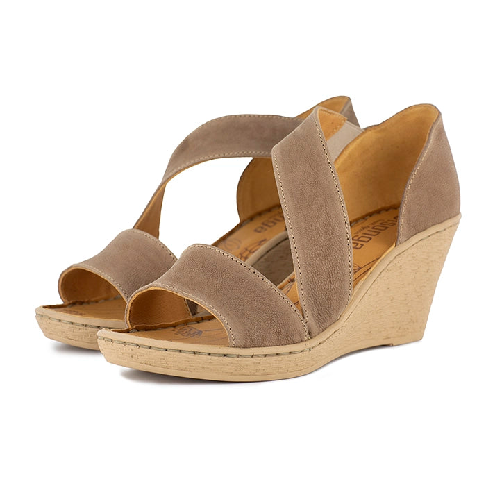 Beige wedge sandals on a white background
