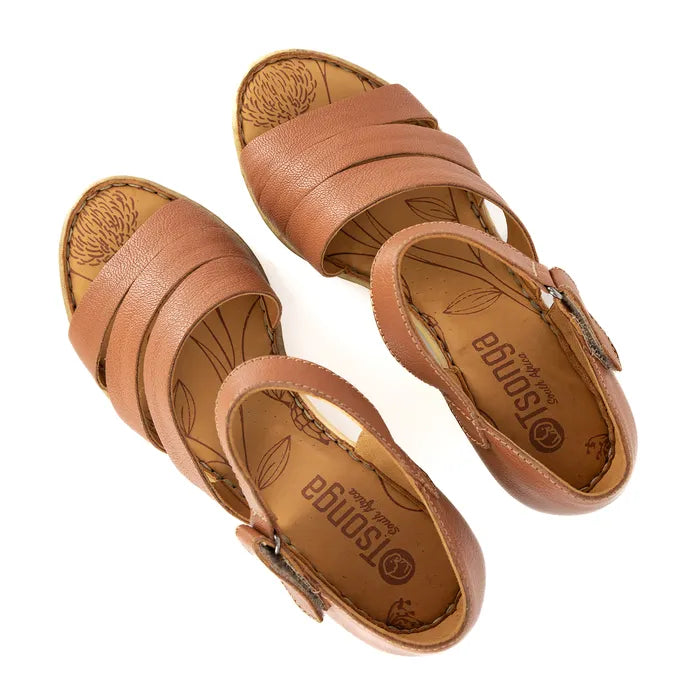 Pair of brown sandals with 'Tsonga' branding on a white background