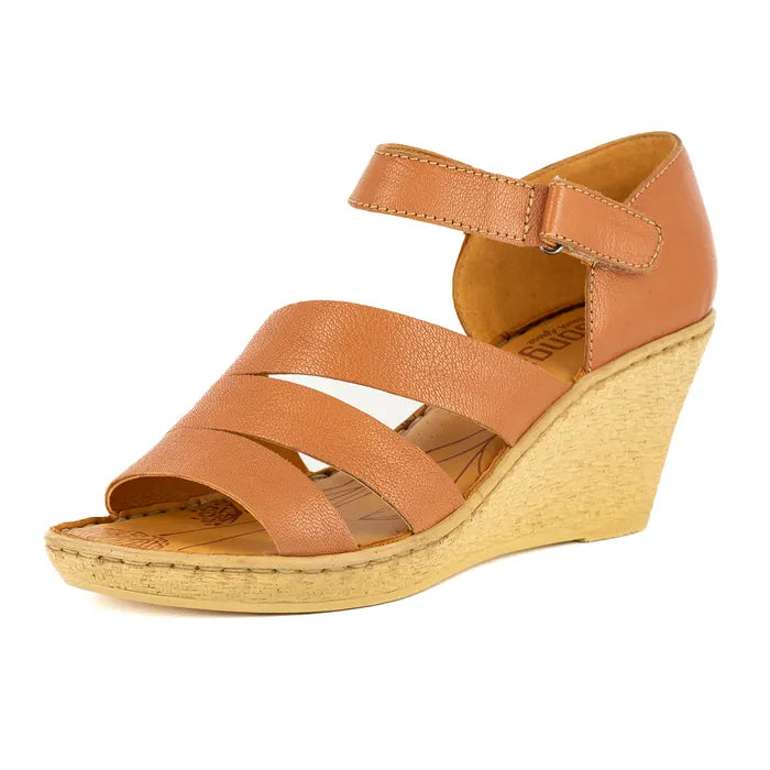 Brown wedge sandal on a white background