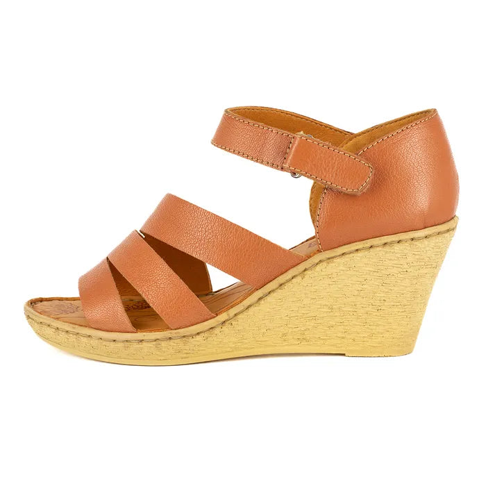Brown wedge sandal on a white background