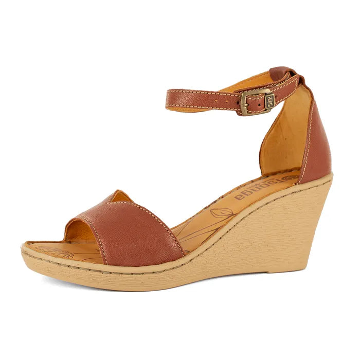 Brown wedge sandal with beige sole on a white background