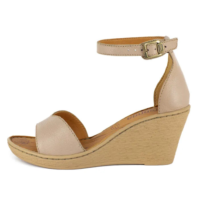 Beige wedge sandal with a ankle strap on a white background