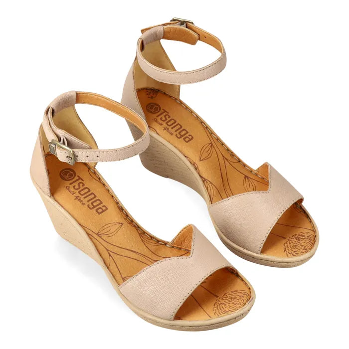 Beige wedge sandals with open-toe design on a white background