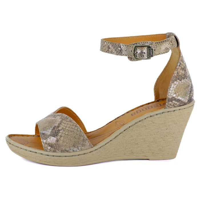 Wedge sandal with glittery strap and beige sole on a white background