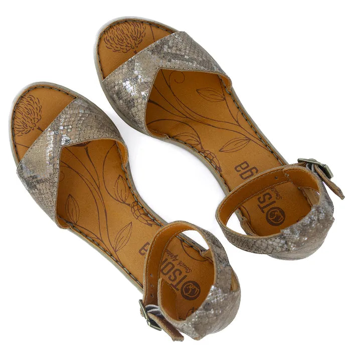 Pair of sandals with glittery and leather-like design on a white background