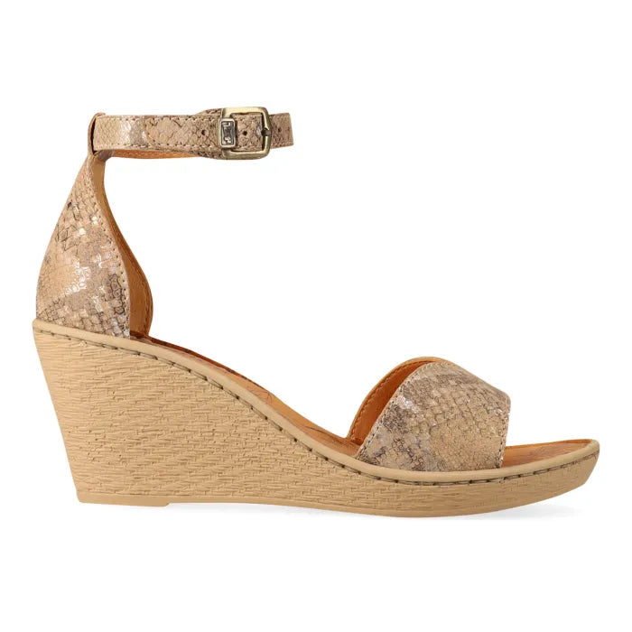 Beige wedge sandal with cork print texture on a white background