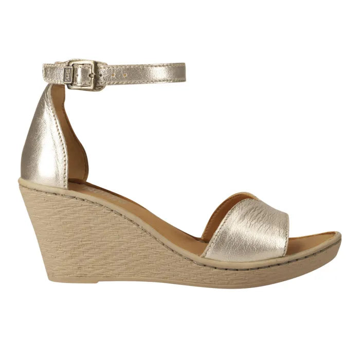 A metallic gold wedge sandal with an ankle strap and open toe, shown from a side profile on a white background.