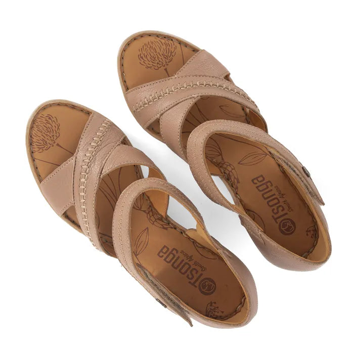 Pair of tan sandals with 'Tsonga' branding on a white background