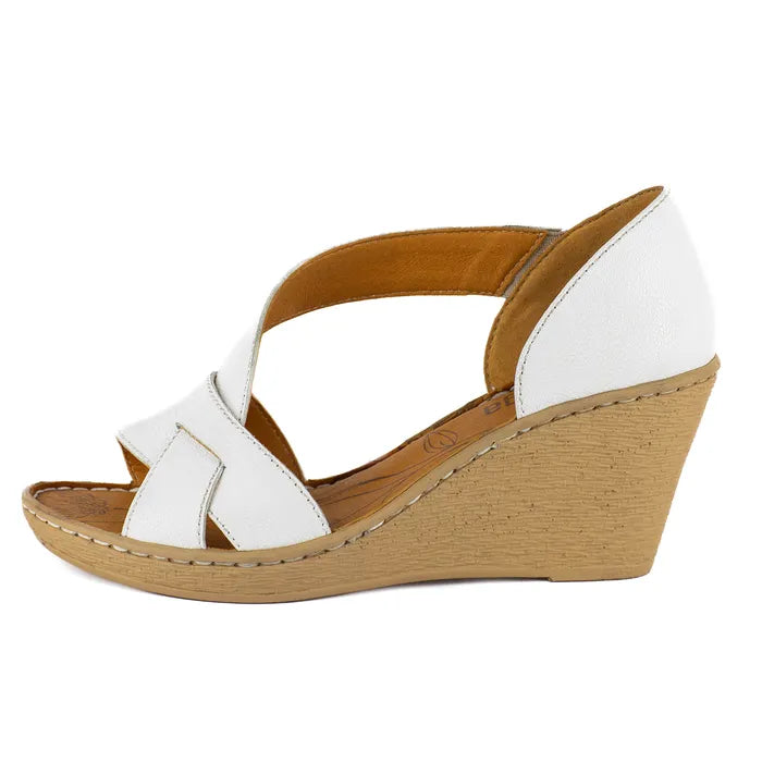 White wedge sandal with beige sole on a white background