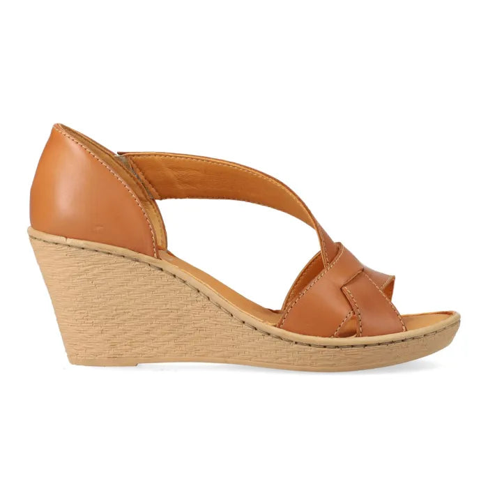 A single women's wedge sandal in tan leather with crisscrossing straps and a wedge heel, shown from a side profile on a white background.