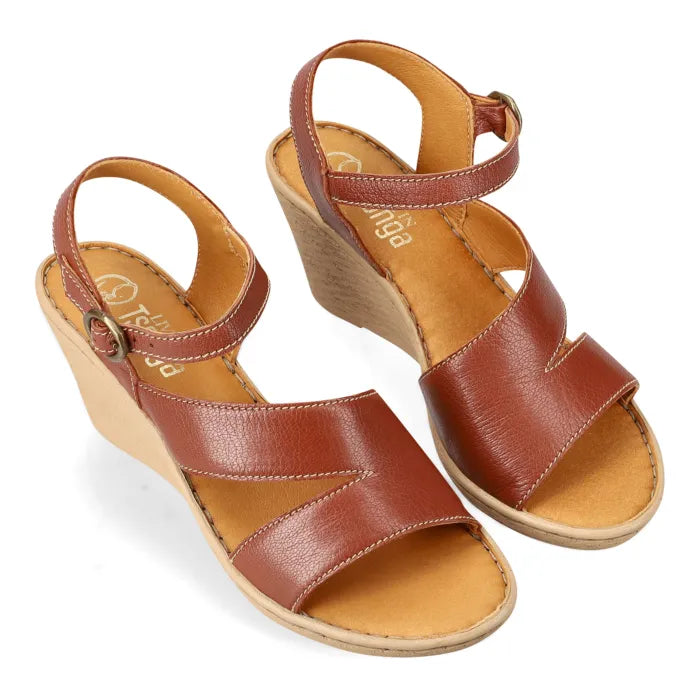 A pair of women's wedge sandals in brown leather with tan insoles and  wedge heels, shown on a plain white background.