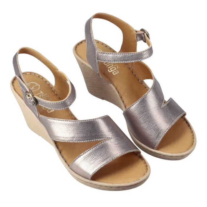A pair of metallic silver wedge sandals with ankle straps and open toes, displayed on a clean white background.