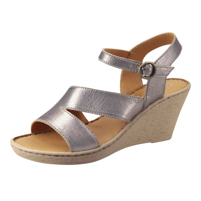 A metallic silver wedge sandal with crisscross front straps and an adjustable ankle strap, shown from a side profile on a white background.