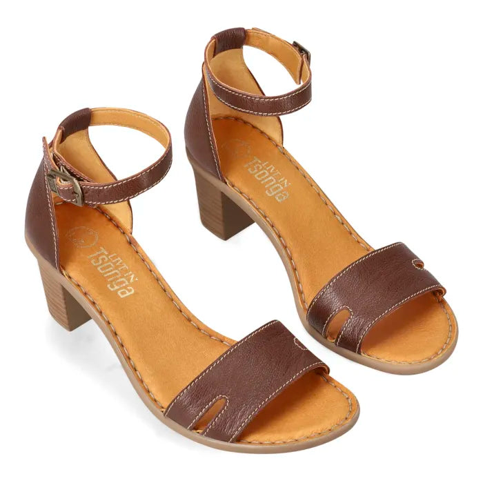 A women's brown leather block-heel sandal with an ankle strap and cutout toe straps, shown from an above profile on a white background.
