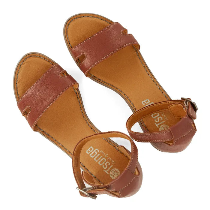 Pair of brown sandals with 'Tsonga' branding on a white background