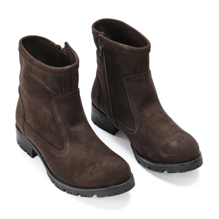 Pair of brown suede boots on a white background