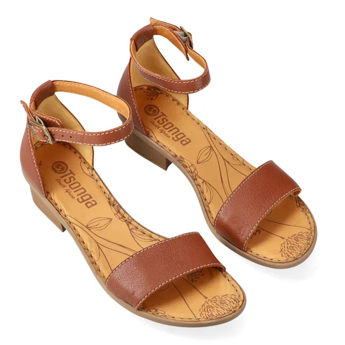 Brown sandals with 'Tsonga' branding on a white background