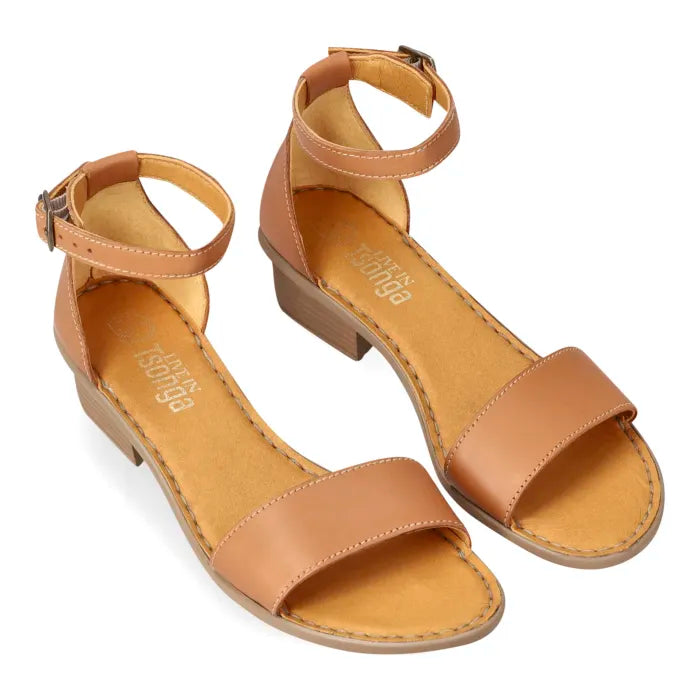 A tan leather block-heel sandal with an ankle strap and a single toe strap, on a white background.