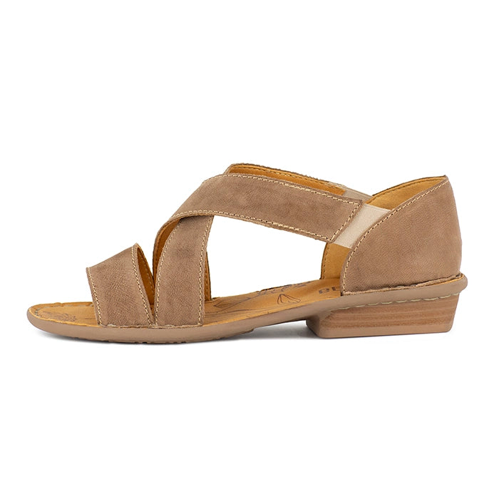 Beige sandal with criss-cross straps on a white background