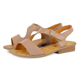 Pair of beige sandals on a white background