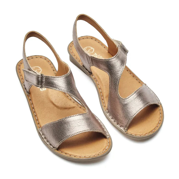 A pair of metallic rose gold leather sandals with tan footbeds, shown on a plain white background.