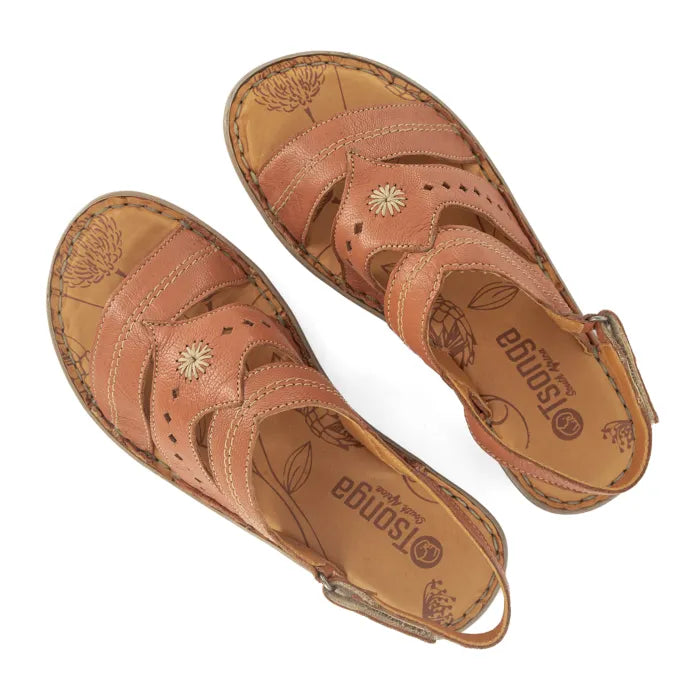 Pair of brown sandals with floral patterns on a white background